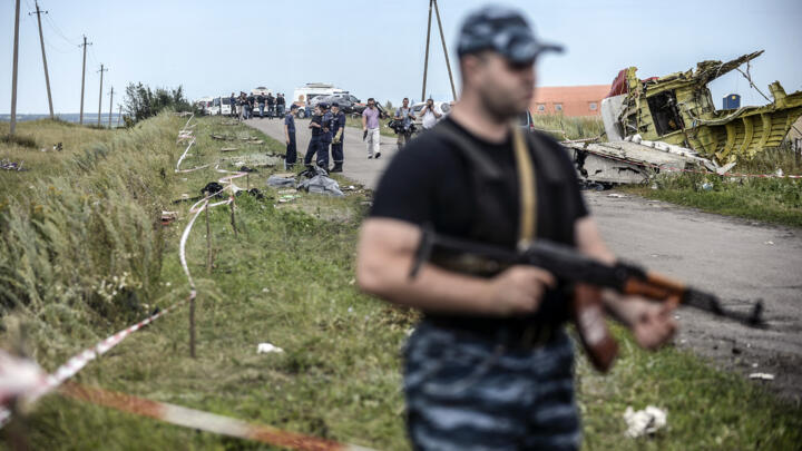 File photo taken on July 20, 2014 of pro-Russian separatists standing guard at the Malaysia Airlines Flight MH17 crash site in the Donetsk region of eastern Ukraine.